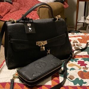 Elegant Black Leather Handbag with matching wallet.
